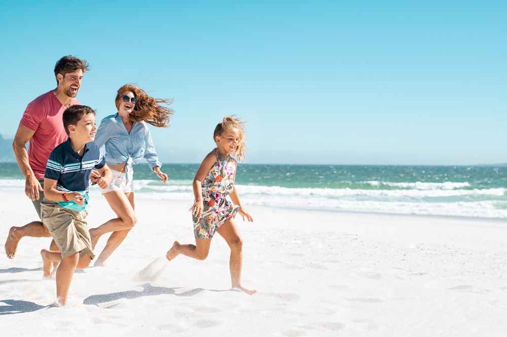 Family Running on the Beach in Lake Worth, Florida.